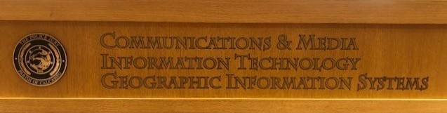 Third floor desk sign showing Information Technology