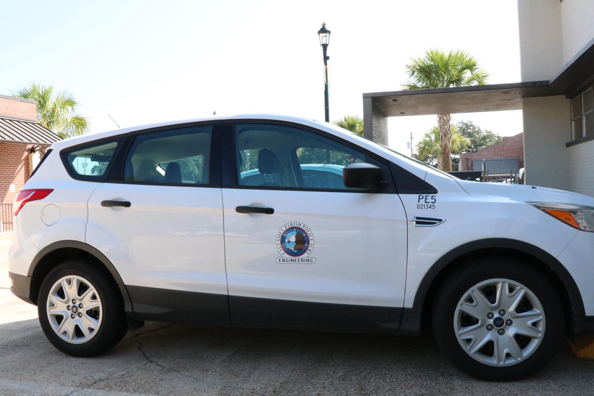 SUV with Calcasieu Parish Police Jury Engineering logo on side